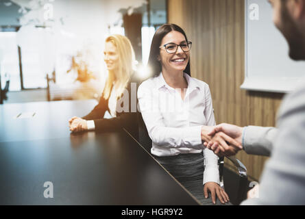 Business people agreement during board meeting in office Stock Photo