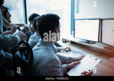 IT colleagues working on software development project in office Stock Photo