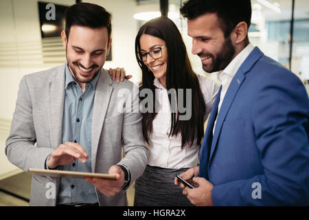 Business people having fun and chatting at workplace office Stock Photo