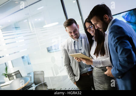 Business people having fun and chatting at workplace office Stock Photo