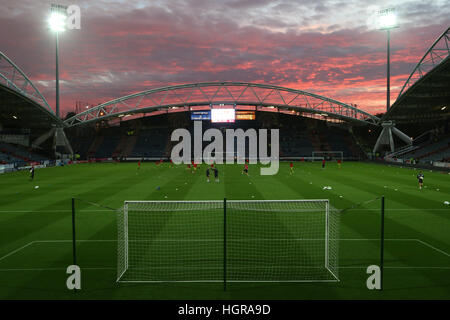 The sun sets over the John Smith's Stadium in Huddersfield before kick off in the Sky Bet Championship tie between Huddersfield Town and Rotherham Uni Stock Photo