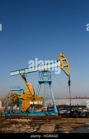 Bucharest, Romania, December 30, 2012: Slate gas or oil equipment with many pipelines, valves, connectors, panel and motors are seen on a field outski Stock Photo