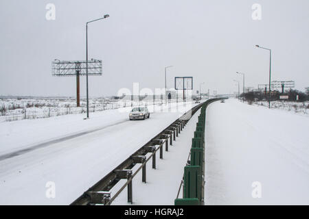 Highway 2, Romania, December 29, 2014: Cars are passing on the highway A2, the main commercial route which connects Bucharest to the Black Sea's port, Stock Photo