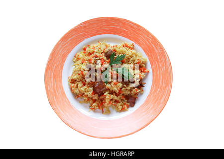 Plate with pilaf on plate. Isolated on white with clipping path Stock Photo