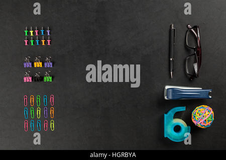 Office supplies on a black table Stock Photo