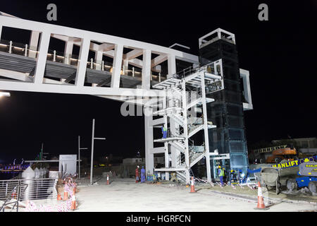 Bridge over the Dubai Water Canal construction site at night Stock Photo