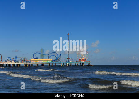 The Pleasure Pier extends over the sea and has rides and attractions in Galveston, Texas, USA. Stock Photo