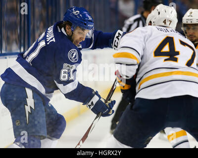 Tampa, Florida, USA. 12th Jan, 2017. Tampa Bay Lightning center Gabriel Dumont (61) battles to control the puck against Buffalo Sabres defenseman Zach Bogosian (47) during first period action at the Amalie Arena in Tampa.  © Dirk Shadd/Tampa Bay Times/ZUMA Wire/Alamy Live News Stock Photo