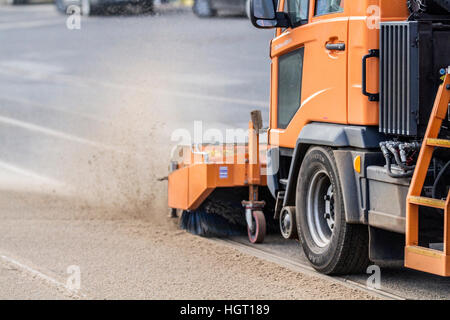 Blackpool, Lancashire, UK. 13th Jan 2017. UK Weather.  The big clean up begins along the Blackpool's not so 'Golden Mile' this morning.  Piles of blown sand had to be cleared from the tram lines so that the network could resume normal service. Credit: MediaWorld Images/Alamy Live News Stock Photo