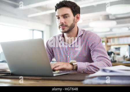 Male architect working with laptop in the office Stock Photo