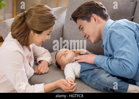 Loving parents taking care of baby Stock Photo