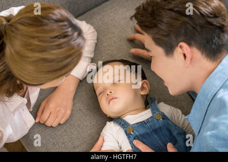 Loving parents taking care of baby Stock Photo
