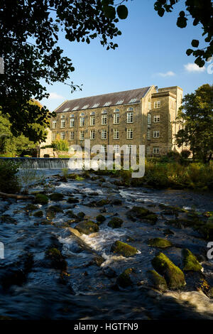 Former cotton mill on the river Derwent converted to  flats Derbyshire England Stock Photo