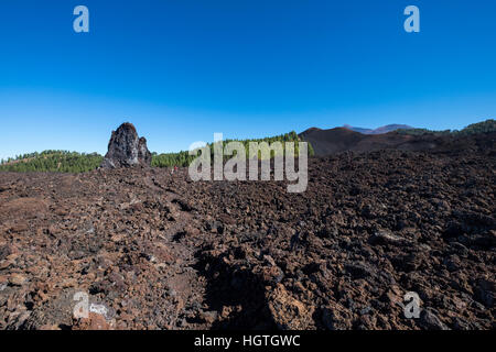 Crossing over the solidified lava flow from Chinyero volcano on Teide, Tenerife, Canary Islands, Spain Stock Photo