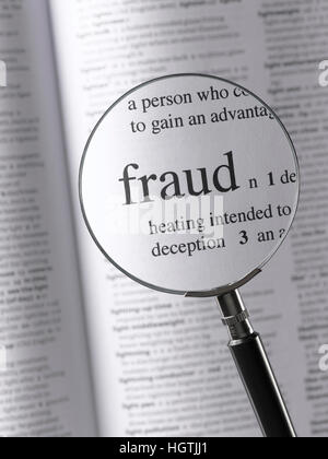 Magnifying glass highlighting fraud Stock Photo