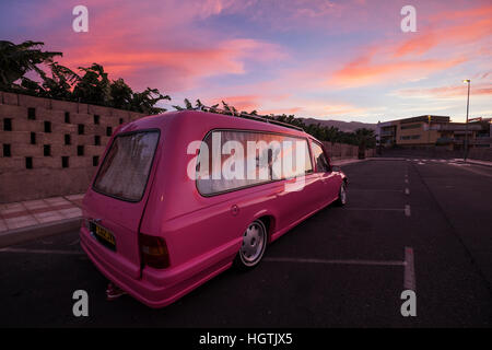 Pink Vauxhall Omega hearse with UK registration being used as a campervan, parked on a side road in Playa San Juan, Tenerife, Stock Photo