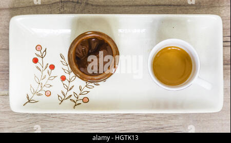 aerial view of a cup of coffee and a chocolate jar Stock Photo