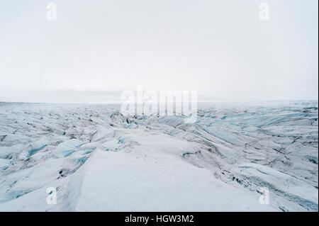 The frozen and barren wasteland of folded ice on the surface of the Greenland Ice Sheet. Stock Photo