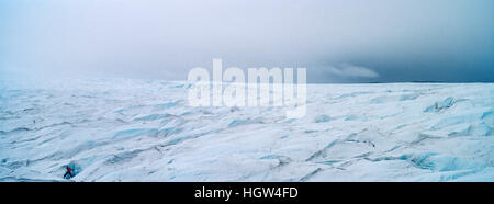 The frozen and barren wasteland of folded ice on the surface of the Greenland Ice Sheet. Stock Photo