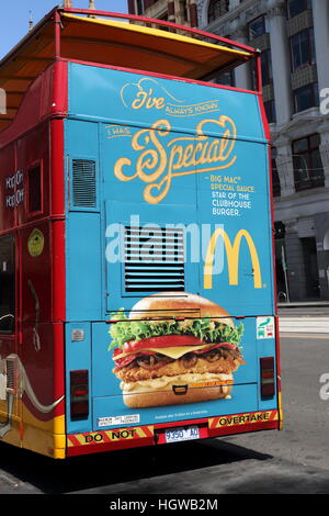 Australian McDonald's advertising at the back of Melbourne Sightseeing Bus parked near Federation square Melbourne  Australia Stock Photo