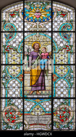 VIENNA, AUSTRIA - DECEMBER 19, 2016: The St. Joseph on the stained glass of church Mariahilfer Kirche Stock Photo