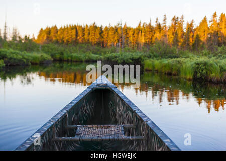 A canoe on the Cold Stream 'deadwater' above Upper Cold Stream Falls in Maine's Northern Forest. Johnson Mountain Township. Stock Photo