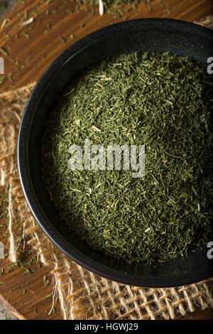 Raw Green Organic Dry Dill Weed in a Bowl Stock Photo