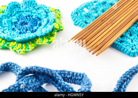 Crochet hooks and wool on white background Stock Photo