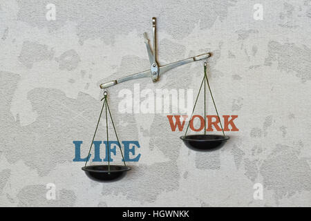 Words Life and Work and a balance on bright background Stock Photo