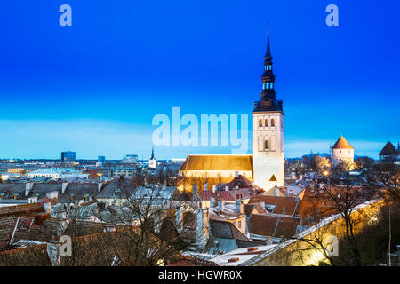 Traditional Old Ancient Architecture In Historic District Of Tallinn, Estonia. St. Nicholas Church - Niguliste Kirik Is A Medieval Church At Winter Ev Stock Photo