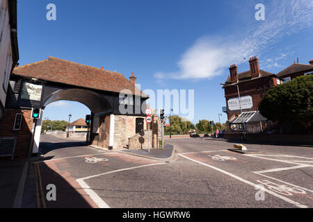 View of the Barbican toll gate, and toll bridge,  in Sandwich, England. The Bell Hotel is on the right. Stock Photo
