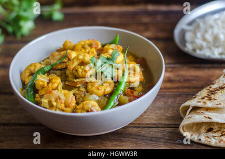 Goan prawn curry with rice and chapatis Stock Photo