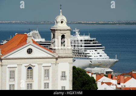 Seven Seas Explorer cruise ship at Santa apolonia passenger terminal, Igreja de Santo Estevao church, Lisbon, Portugal Stock Photo