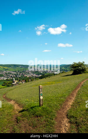 View from The Cotswold Way long distance footpath over Selsley village and church towards Stroud on the edge of the Cotswold Hills, Gloucestershire, UK Stock Photo