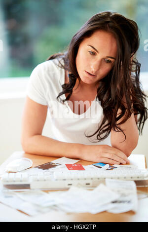 Woman stressed with her finances Stock Photo