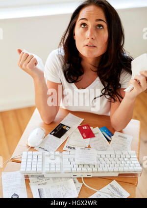 Woman stressed with her finances Stock Photo
