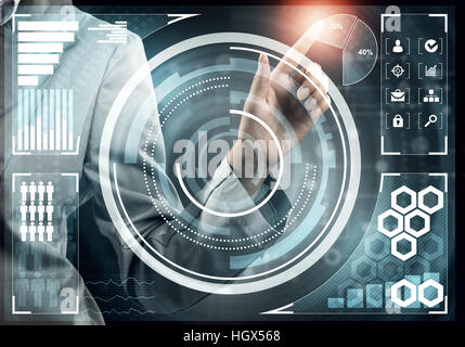 Hand of businesswoman pressing with finger icon on media screen Stock Photo