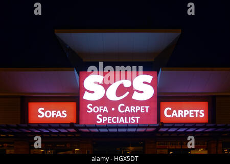 scs sofa carpets sign at night Great Western Retail Park Stock Photo