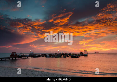 Aruba, Caribbean - September 25, 2012: Picture showing the Golden hour with  sail boats on sea anchored by the sunset. The image was taken in Aruba, i Stock Photo