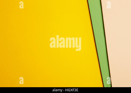 Colored cardboards background in yellow green beige tone. Copy space. Horizontal Stock Photo