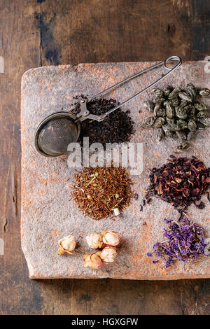 Variety of dry tea with teapot Stock Photo