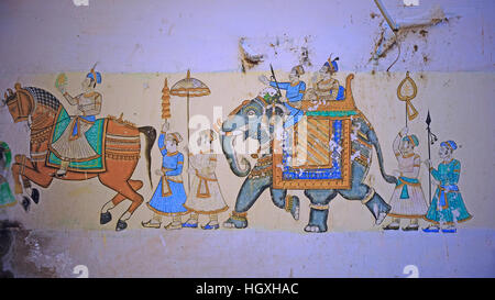 Decaying wall art on a building in Udaipur, India, displaying a level of detail characteristic of the Rajasthani tradition Stock Photo