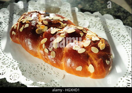Tsoureki traditional Greek Easter bread with sliced or slivered almonds Stock Photo