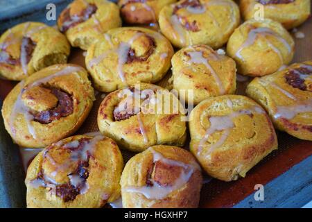Tray of freshly baked vegan pumpkin cinnamon rolls Stock Photo