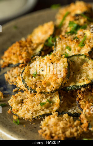 Homemade Breaded Baked Zucchini Chips with Dipping Sauce Stock Photo