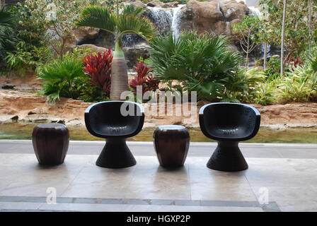 modern designer chairs in outdoor seating area of Caribbean hotel Stock Photo