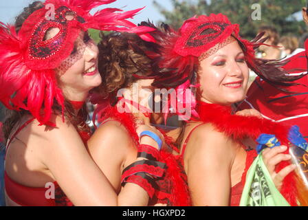 carnival dancers in bright red costumes Stock Photo