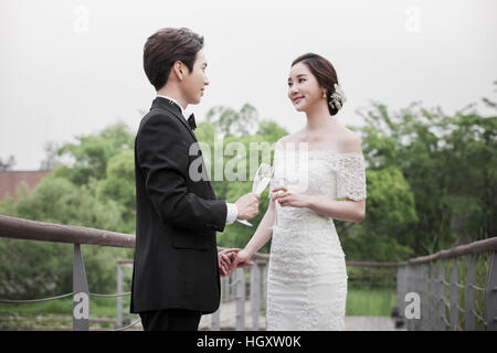 Smiling.wedding couple toasting Stock Photo