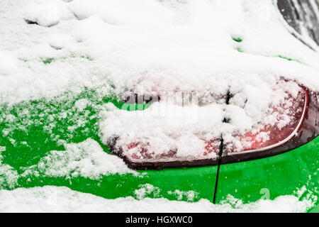 Car Covered With Fresh White Snow After A Heavy Blizzard Stock Photo
