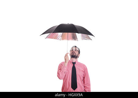 Man standing under umbrella Stock Photo